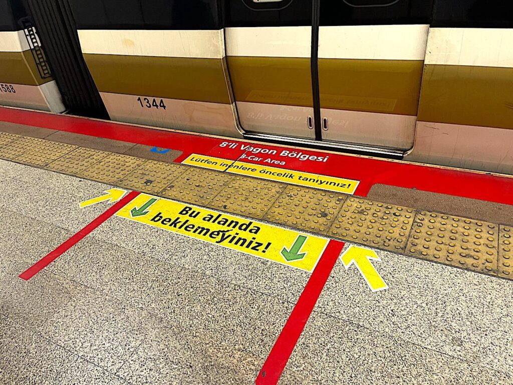 "Priority to those who disembark, do not wait in this area!"